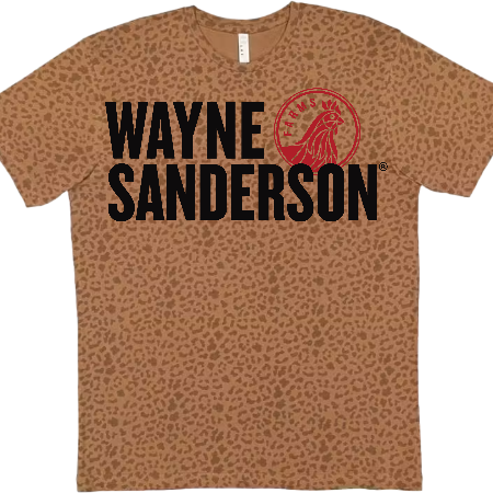 A short-sleeve crewneck t-shirt with a brown and tan leopard print pattern, featuring the text 'WAYNE SANDERSON' in black and a red circular logo on the chest.